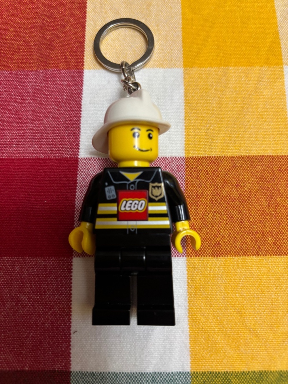 LEGO "LED Torch/keychain Fireman" UC21176-1 with working batteries. No box.